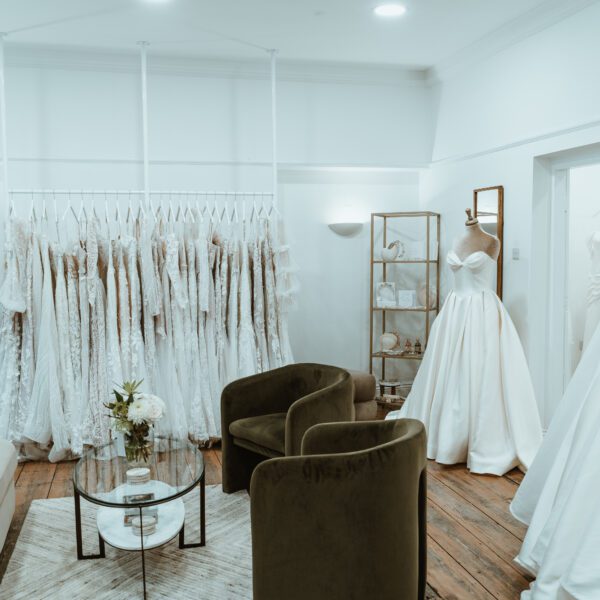 Bridal showroom You Are Precious Bridal in Newcastle filled with wedding dresses hanging in a rail