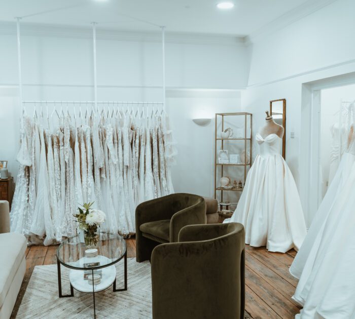 Bridal showroom You Are Precious Bridal in Newcastle filled with wedding dresses hanging in a rail