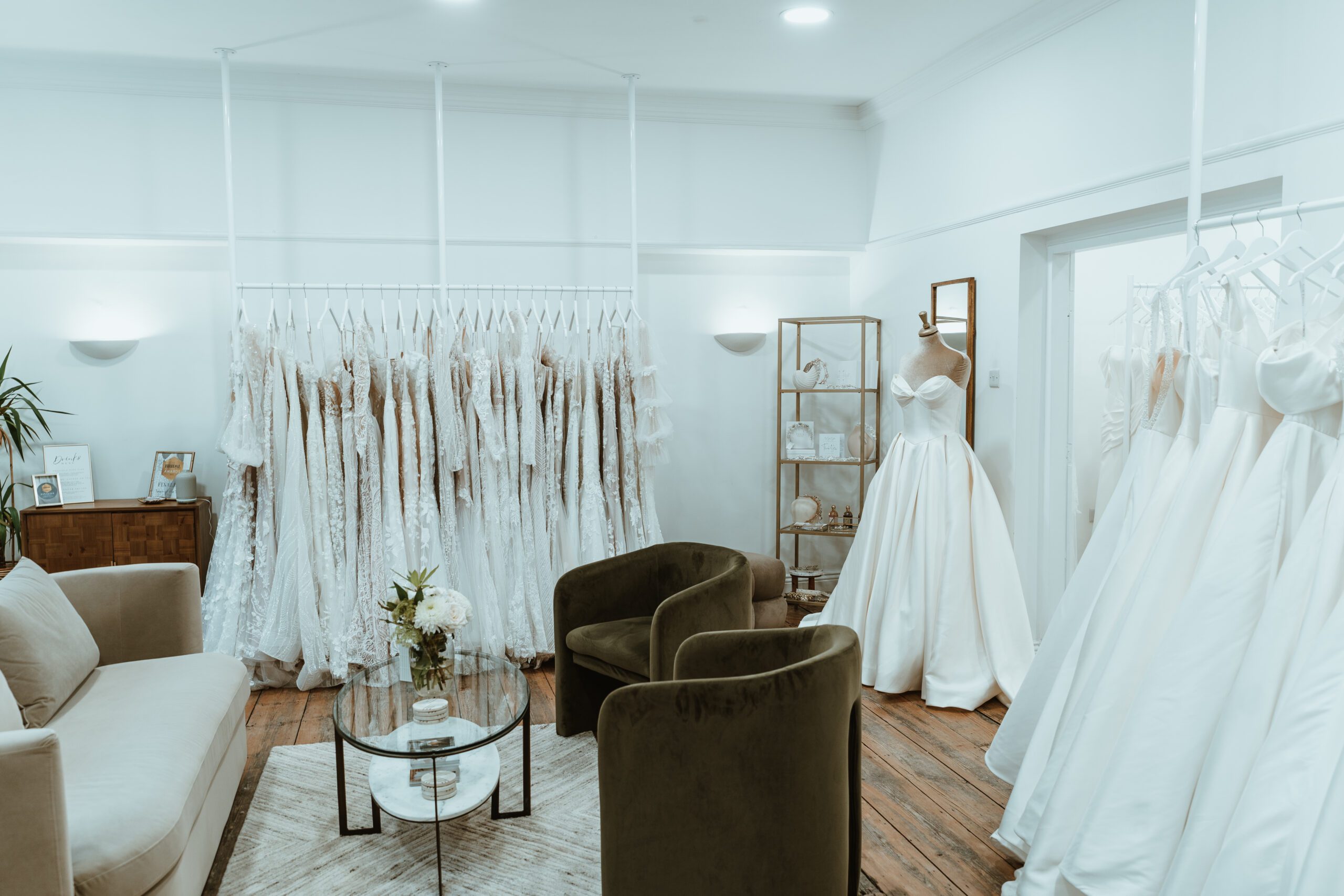 Bridal showroom You Are Precious Bridal in Newcastle filled with wedding dresses hanging in a rail