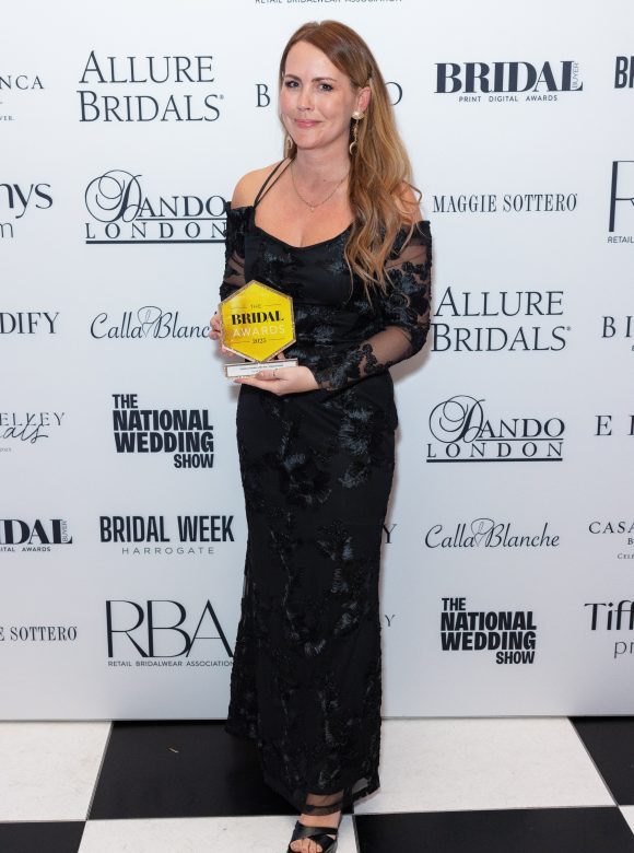 Danni - Owner of You Are Precious holding bridalwear retailer of the year award